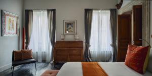 Cama ou camas em um quarto em Palazzo Delle Pietre - Luxury Apartments