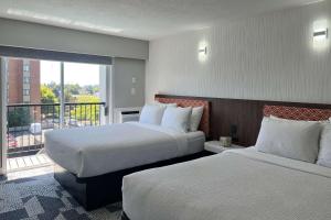 Tempat tidur dalam kamar di The Vic, Ascend Hotel Collection