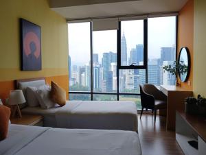 A bed or beds in a room at Ceylonz Suite By ANA MALAYSIA