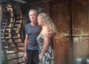 a man and a woman standing in front of a door at Sopanam Heritage Thekkady in Thekkady