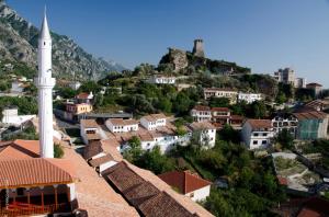 a view of a town with a mosque on a hill at Hotel PANORAMA Kruje view on the castle and the old town in Krujë