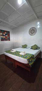 A bed or beds in a room at Gombela Ecolodge and Farming