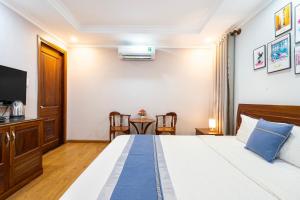 A bed or beds in a room at CAMY Hotel Vung Tau