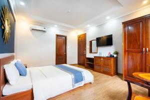 A bed or beds in a room at CAMY Hotel Vung Tau