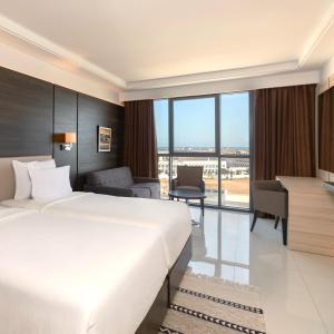 Ένα ή περισσότερα κρεβάτια σε δωμάτιο στο Radisson Hotel Sfax