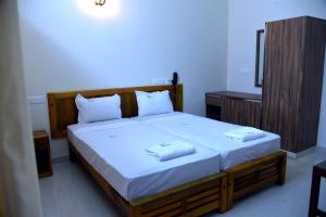 Villa Varkala में एक कमरे में एक या कई बेड