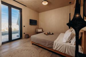 Krevet ili kreveti u jedinici u objektu Princess Luxury Suites Adults Only - Princess Hotels Collection