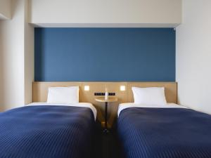 Кровать или кровати в номере Kansai Airport Washington Hotel