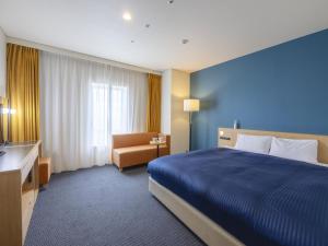 Кровать или кровати в номере Kansai Airport Washington Hotel