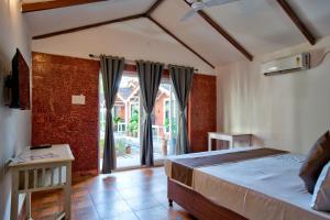 Krevet ili kreveti u jedinici u okviru objekta Homes Stay In Candolim GOA