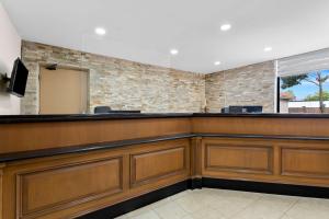 a bar in a waiting area at SureStay Plus by Best Western Windsor in Windsor