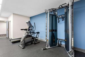 a gym with a treadmill and a tread machine at SureStay Plus by Best Western Windsor in Windsor