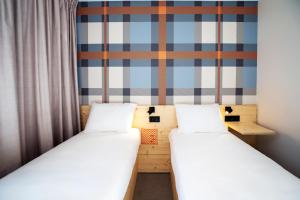 A bed or beds in a room at easyHotel Marseille Euromed