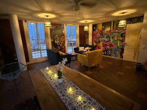 a living room with a couch and a table at Casa Talavera Hostel in Mexico City