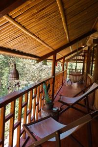 a porch of a house with a wooden ceiling at Sapa's soul hillside in Sa Pa