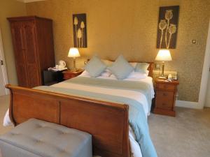 Cama ou camas em um quarto em Brook Manor Lodge