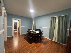 a dining room with a table and chairs in it at Getaway at Niagara in Niagara Falls