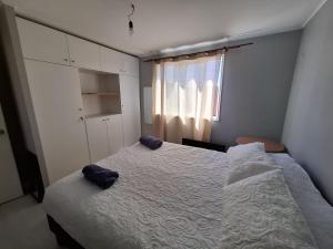 A bed or beds in a room at Agradable casa en Puerto Varas