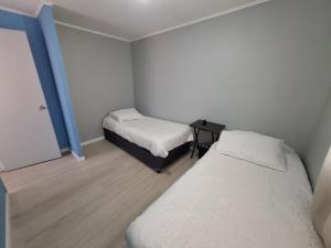 A bed or beds in a room at Agradable casa en Puerto Varas