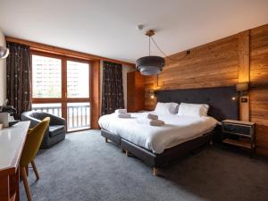 Giường trong phòng chung tại Chalet Hotel Ducs de Savoie