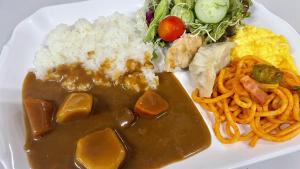 a plate of food with rice and other foods at Toyoko Inn Wako-shi Ekimae in Wako