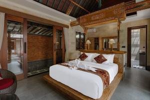 Monique Ubud Villa में एक कमरे में एक या कई बेड