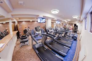 a fitness room with treadmills and cardio equipment at Hotel Agit Congress&Spa in Lublin