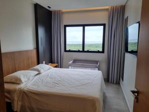 Giường trong phòng chung tại Salinas premium resort