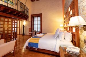 A bed or beds in a room at Hotel Boutique Casona de la China Poblana - Adults Only