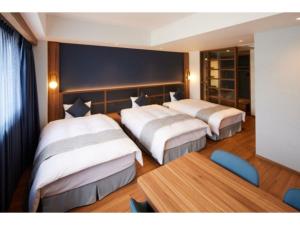 Giường trong phòng chung tại ＨＯＴＥＬ ＳＡＩＬＳ - Vacation STAY 37426v