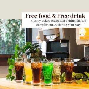 a group of glasses filled with drinks on a counter at HOTEL RELIEF Kokura Station in Kitakyushu