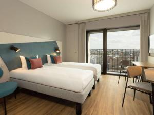 Cama ou camas em um quarto em Adagio Antwerp City Center