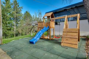 a playground with a blue slide and a ladder at Relax house MAROKIS in Karlovac