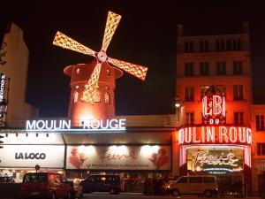 a building with a windmill on top of it at ibis Paris Montmartre Sacré-Coeur in Paris