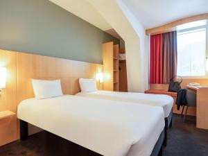 เตียงในห้องที่ ibis Lausanne Centre