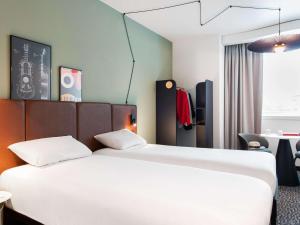 เตียงในห้องที่ ibis Lausanne Centre