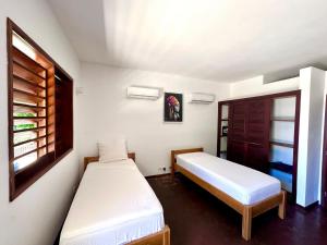 A bed or beds in a room at Anki Lodge