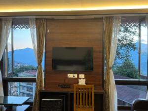 A television and/or entertainment centre at Hotel Lha-yul nearby MG Road Gangtok