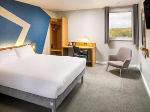 Giường trong phòng chung tại ibis budget London Heathrow Central