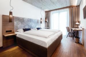 Кровать или кровати в номере arte Hotel Kufstein