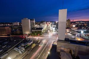 a city at night with traffic on a street at Hotel Alpha Inn Akita - Vacation STAY 67295v in Akita