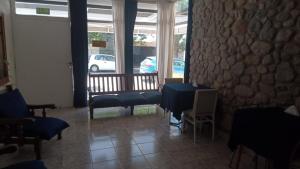 a room with a table and chairs and a window at cronos hotel in Villa Carlos Paz