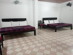 A bed or beds in a room at Hotel Hill Town Coorg