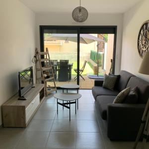 Prostor za sedenje u objektu Appartement T2 - Rez-de-Jardin, proche plage et commerces