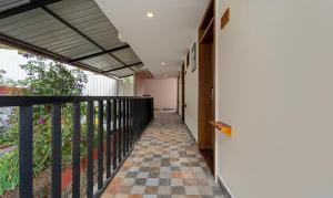 a hallway of a house with a checkered floor at Treebo Tranquil Heights in Kodaikānāl