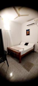 Whitefort Rohini Homestay -Serviced Villa में एक कमरे में एक या कई बेड