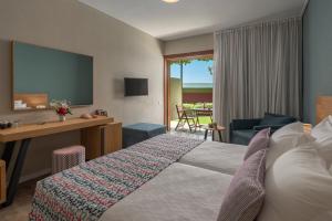 Voodi või voodid majutusasutuse Skiathos Palace Hotel toas