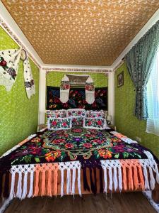 Una cama o camas en una habitación de Floare de Maramures 1