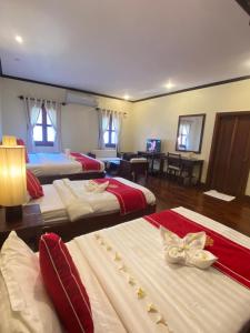 Luang Prabang Residence & Travel में एक कमरे में एक या कई बेड