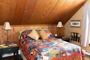 A bed or beds in a room at Rustic Farmhouse in Gaspereau Valley Wine Country!